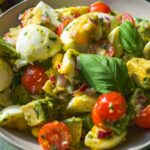 Egg salad with avocados and tomatoes with parsley vinaigrette.