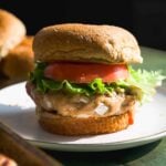 Turkey burger with a bun on a plate.
