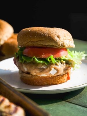 Turkey burger with a bun on a plate.