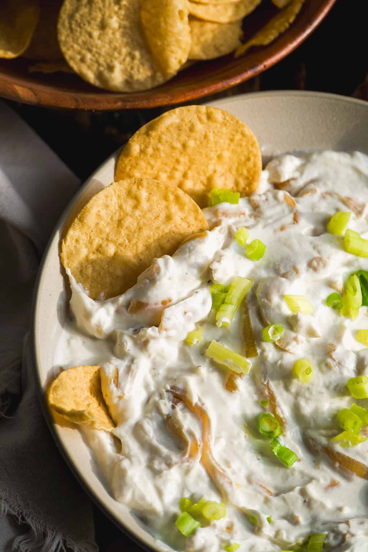 Greek yogurt french onion dip with chips on the side.