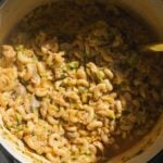 Hamburger helper in a pot with zucchini and mushrooms.