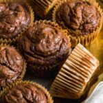 Chocolate pumpkin banana muffins on a serving platter.