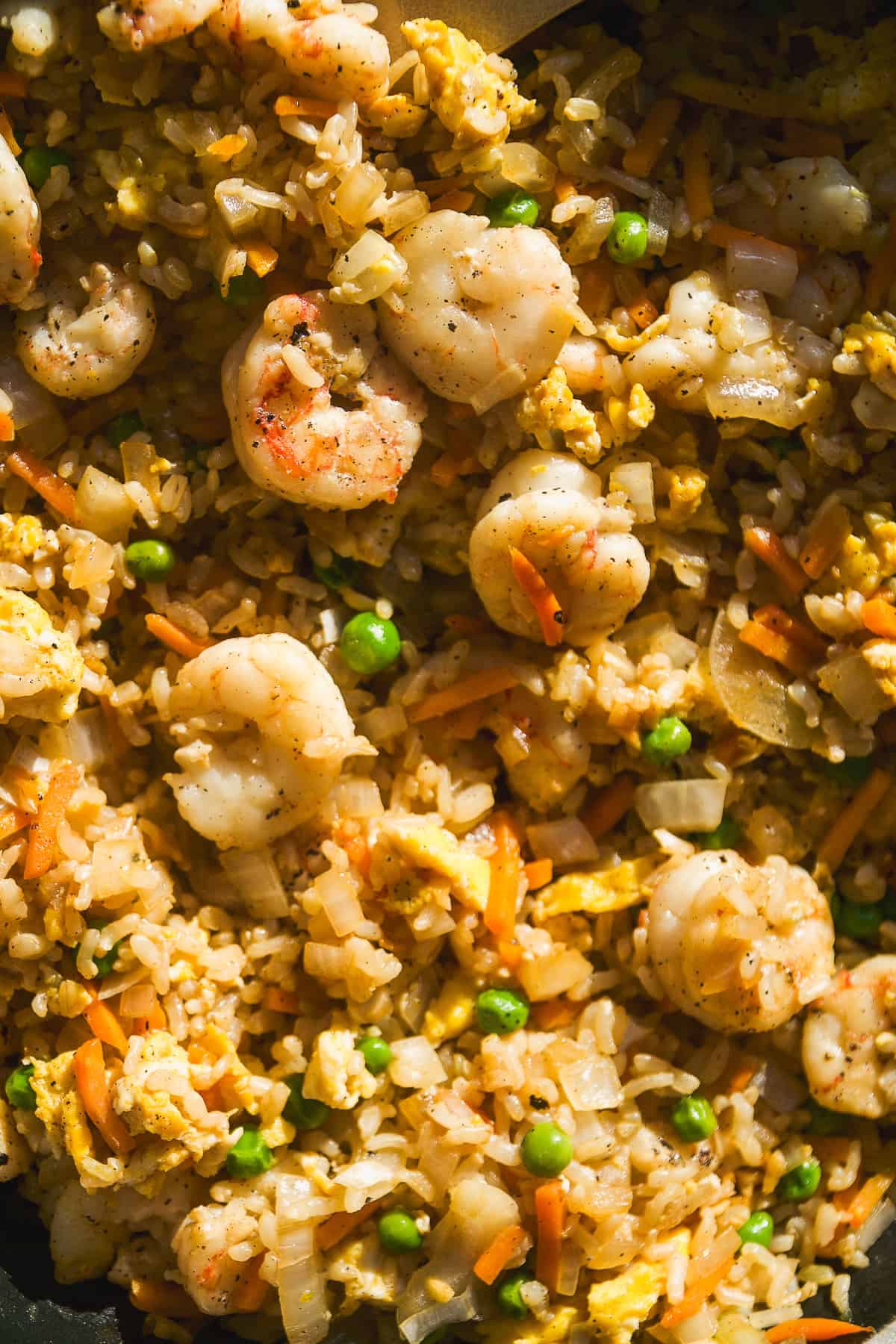 Closeup of a 30 minute meal of shrimp with rice and peas.