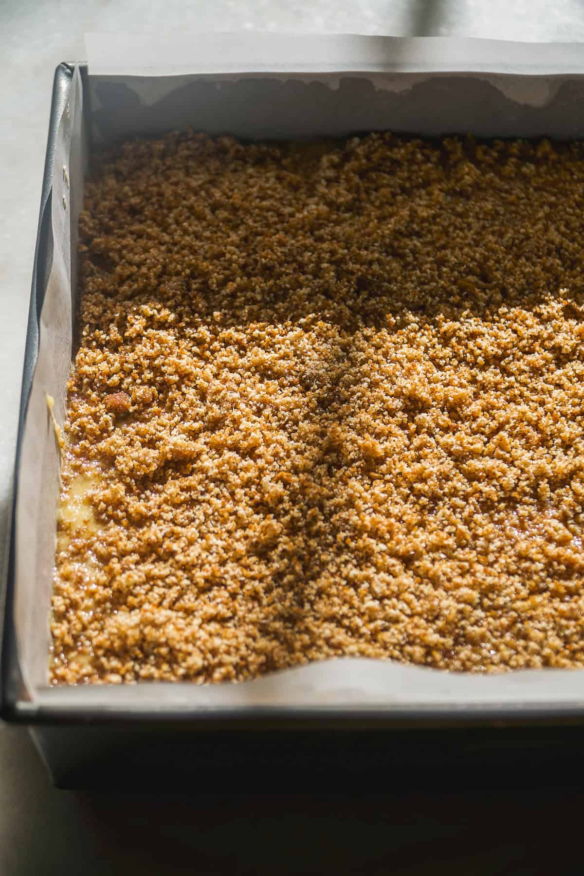 Banana bread coffee cake with crumble on top about to be baked.