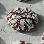 Chocolate crinkle cookies baked on a pan.