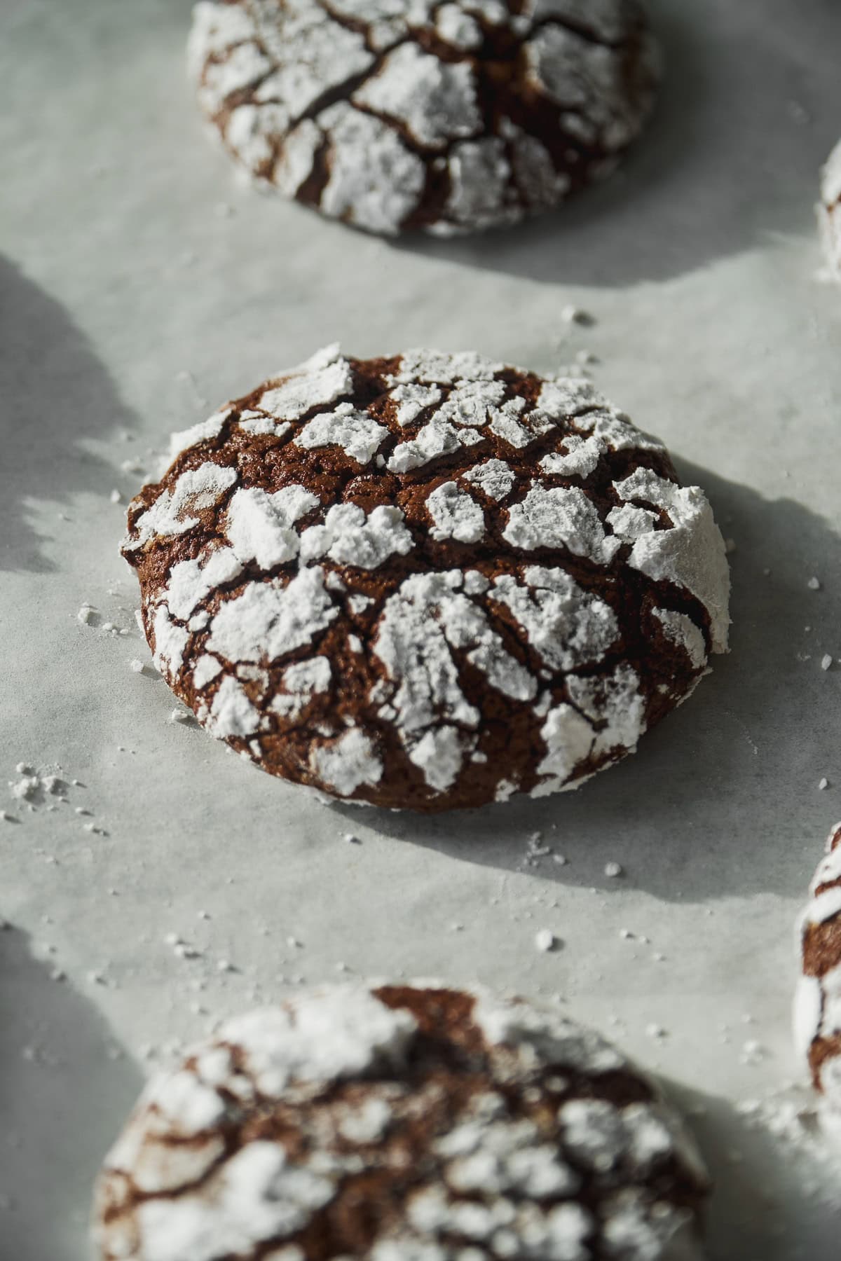 Chocolate crinkle cookies baked on a pan.