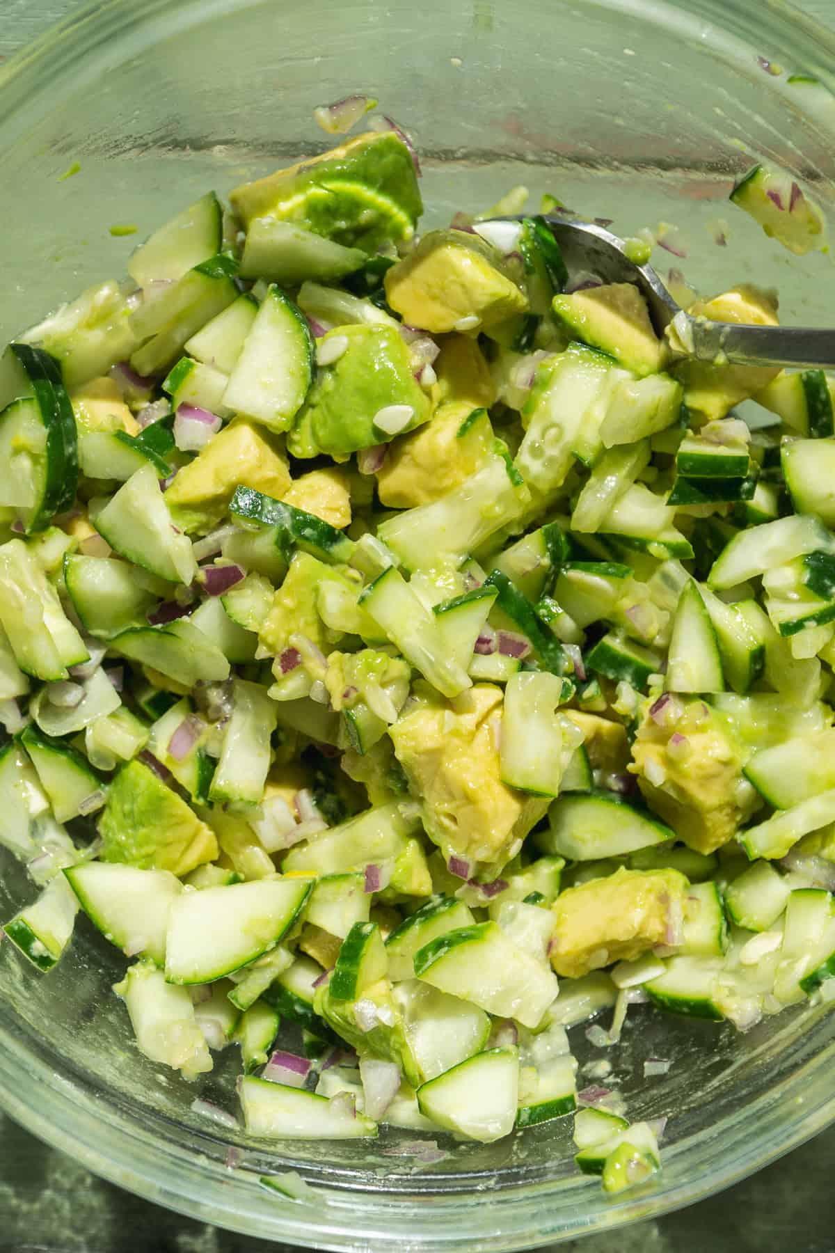 Cucumber avocado salad in a bowl.