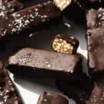 Chocolate coated crunch bars with sea salt on top.