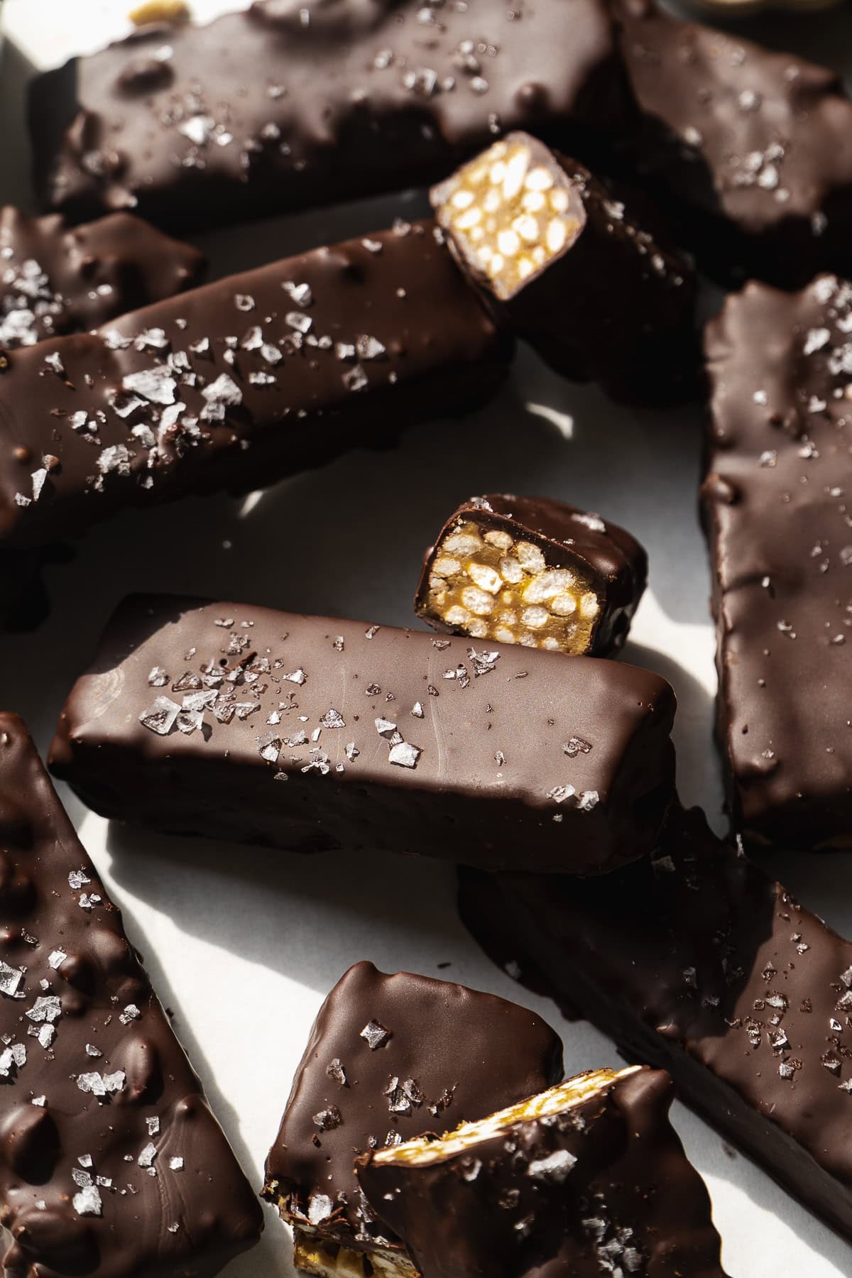 Chocolate coated crunch bars with sea salt on top.