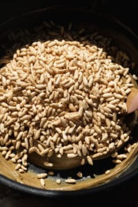 Puffed rice about to be mixed with melted sunflower butter in a large pot.