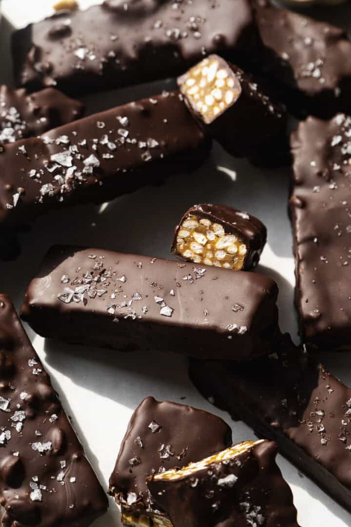 Chocolate crunch bars with sunflower filling on a platter.