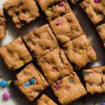 Almond butter cookie bars cut into squares on a platter.
