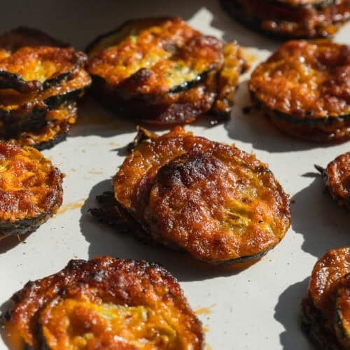 Zucchini pizza bites on a plate.