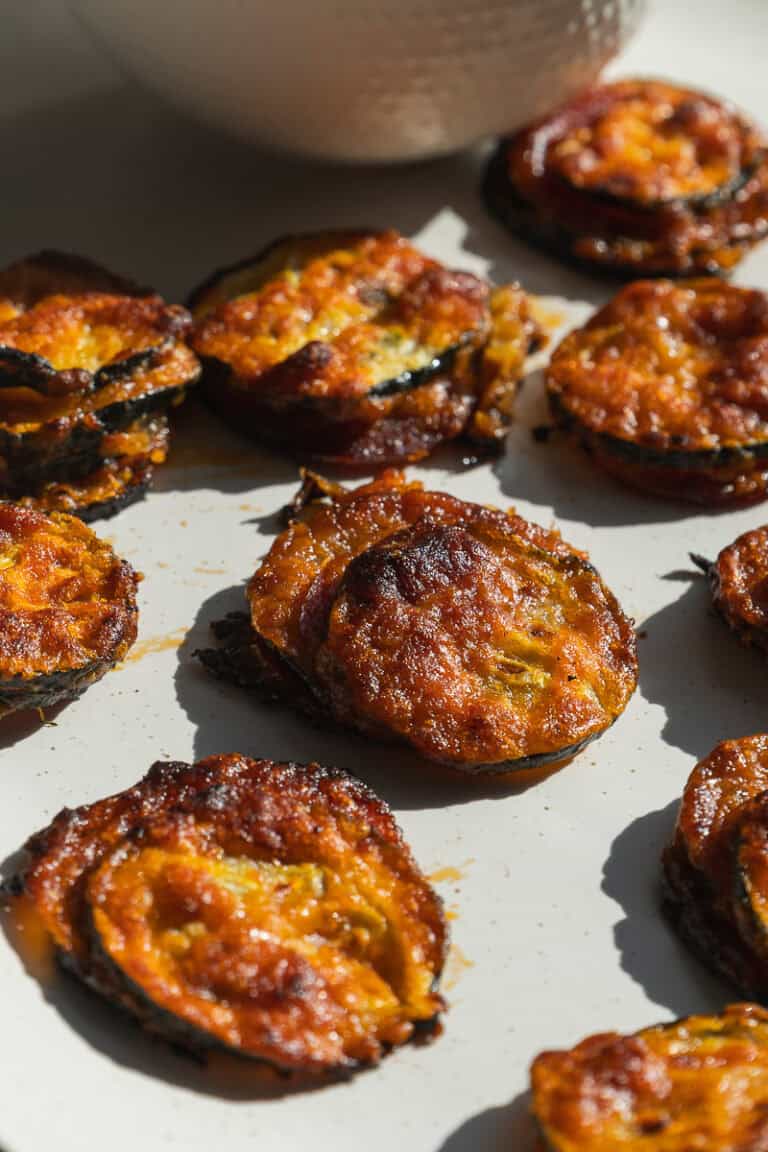 Zucchini pizza bites on a plate.