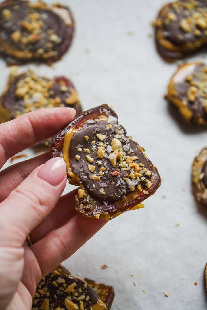 Person holding a smashed date snicker.