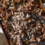 A baking sheet filled with shredded pulled pork.